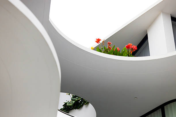 Closeup low angle view of modern, new apartment building, background with copy space, full frame horizontal composition