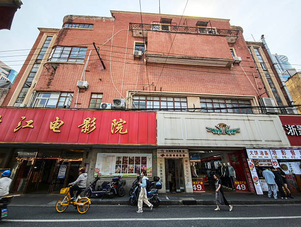 People walking on the street surrounded by old fashioned residential building in Huangpu district, Shanghai, China.