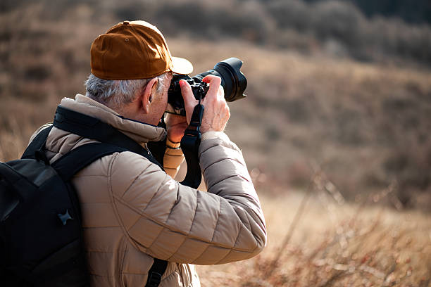 istock Senior man photographing 2263105180