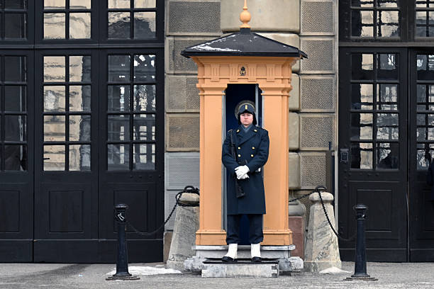Stockholm, Sweden - February 19, 2026:Royal Guard outside the Stockholm Palace on a cold day in Stockholm, Sweden