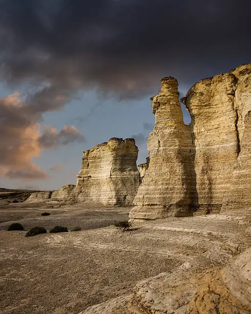 Photo of Dramatic Twilight over Monument Rocks Chalk Pyramids