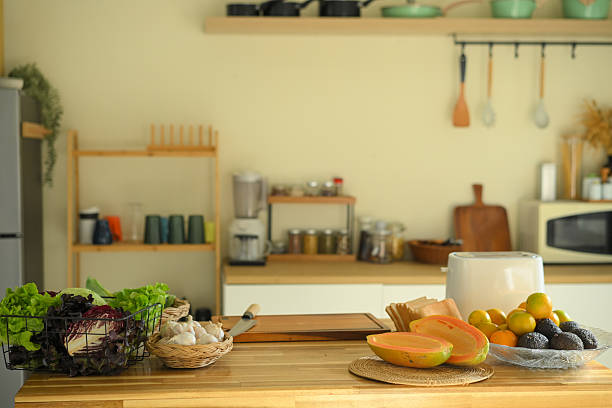 Fresh healthy food ingredients on kitchen counter, vegetables and fruits prepared for nutritious home cooking and balanced diet