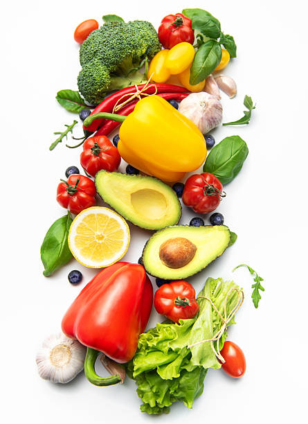 Fresh healthy eating vegetables and fruits on white