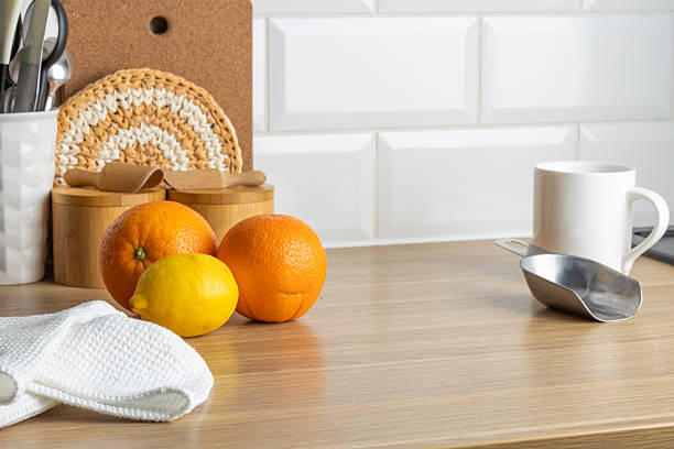 istock A clean kitchen counter with fresh oranges and a cup, ready for a morning tea break. 2263140785