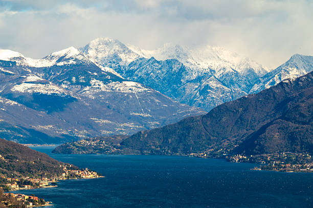 View of Lake Como, with the village of Menaggio and the snow-capped mountains overlooking it, in winter.