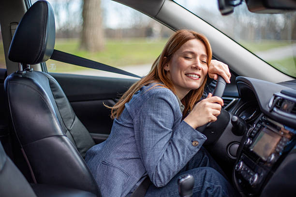 istock Happy woman experiencing joy driving car 2263165250