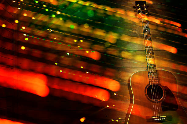 A guitar rests on a wooden surface. Colorful light patterns fill the space, creating a lively atmosphere. This scene suggests an evening of music and creativity.