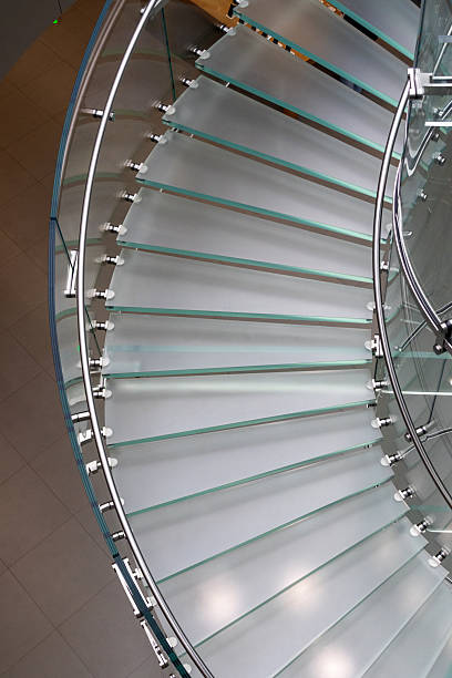 istock Staircase made from glass and form a spiral shape. 2263204823