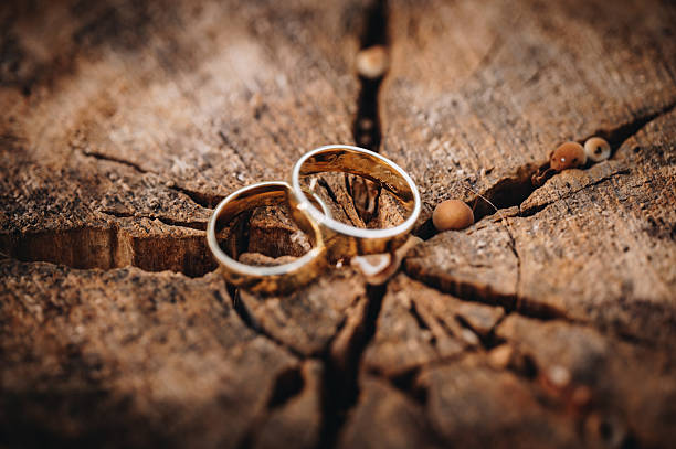 istock Wedding rings on a wooden surface 2263219833