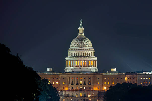 istock US Capitol building illuminated at night under dark sky 2263225413