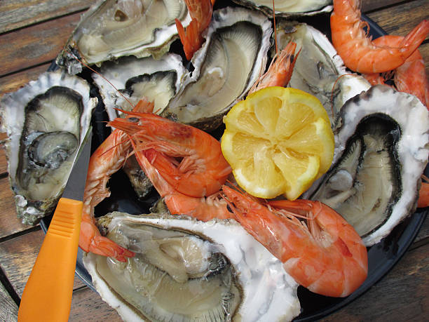 Platter of oysters and king prawns ready to eat