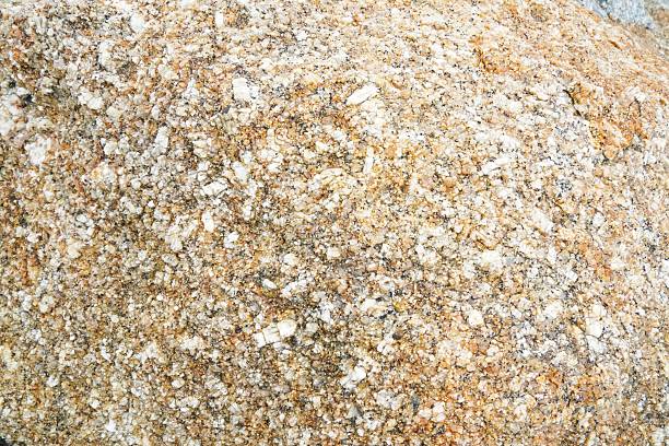 Square granite pavement cobblestone block is isolated.