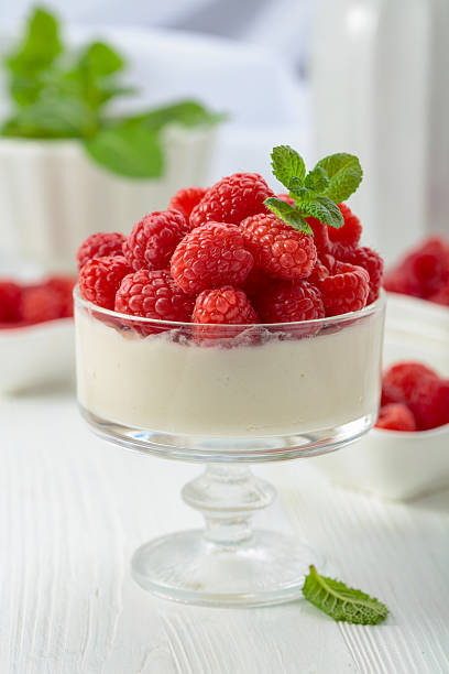 Panna cotta with fresh raspberries.