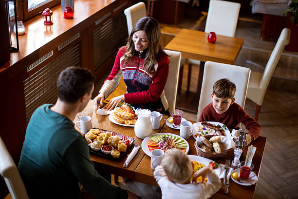 istock Family enjoys a meal at a restaurant in a cozy setting during breakfast time 2263269372