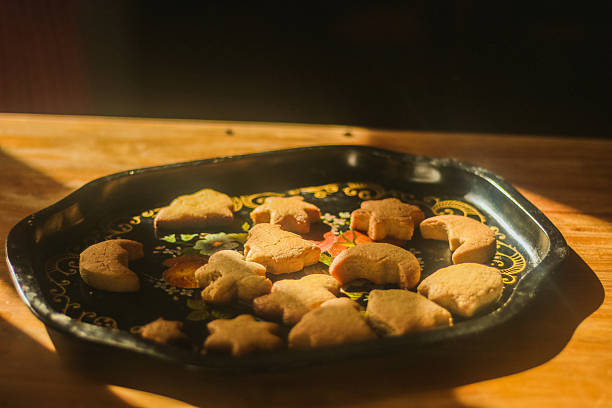 Homemade holiday cookies arranged on an old-fashioned tray, celebrating traditions