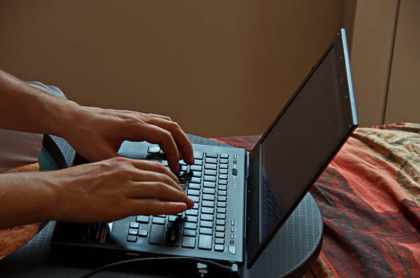 A view of an operator working on a notebook at home, Sofia, Bulgaria