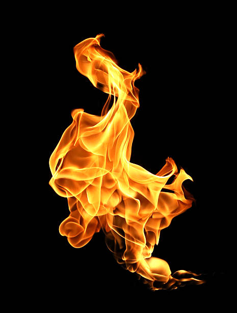 Realistic single fire flame isolated on black background with glowing orange light and fluid motion. High resolution burning blaze element for overlay design, dramatic effect, heat and energy concept.