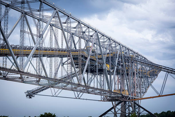 Steel giant excavator machine with conveyor bridge used in brown coal opencast mining, Germany