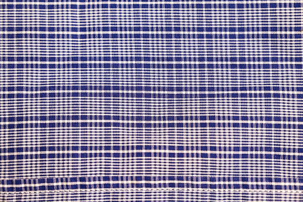Close up of a blue and white tablecloth perfect for backgrounds.