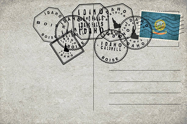 Idaho Vintage Postcard with Flag Stamp and City Postmarks