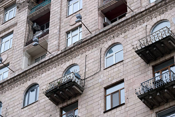 Balconies filled with plants showcase vibrant urban life in a historic structure. Kyiv, Ukraine. December 12, 2025.
