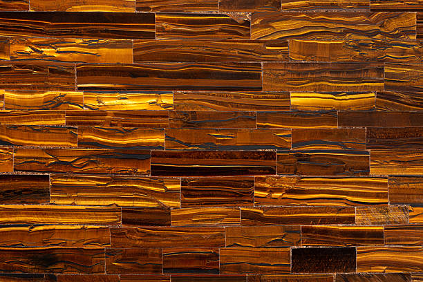 Tiger Eye Golden. Matt natural semi precious mineral pattern. Polished semiprecious stone for ceramic wall and floor digital tiles. Material for unique interior, exterior design decoration.