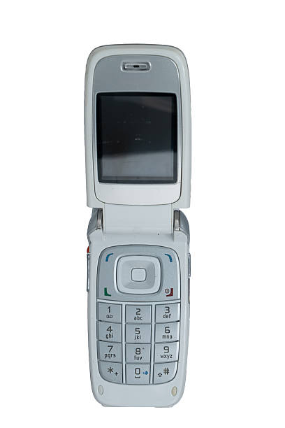White flip phone featuring a keypad and small screen on a white background