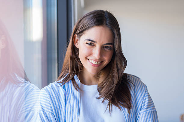 istock A positive young student or professional poses near a window wit 2263401641
