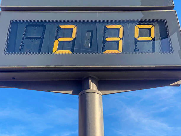 Low angle view of billboard showing 23 degrees celsius of temperature in the city of Valencia, Spain