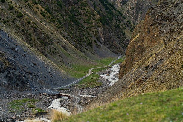 Narrow river gorge surrounded by dry mountain slopes in Dagestan, Russia.