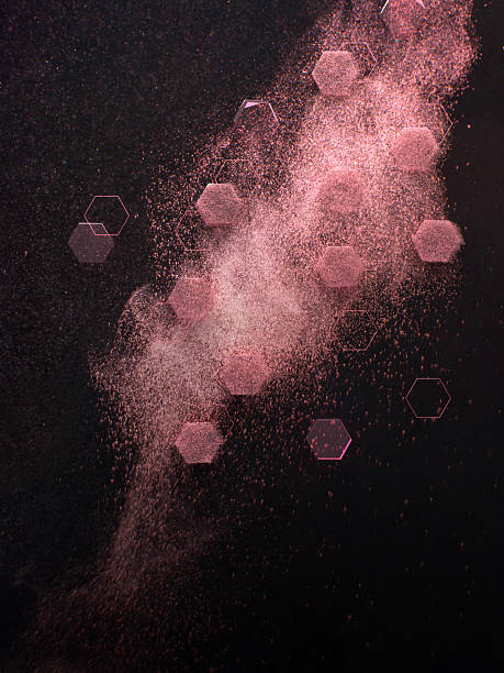 Elegant pink glittery powder explosion mixed with geometric hexagon shapes in motion, symbolizing luxury beauty products and cosmetic innovation. Photography and 3D rendering combined.