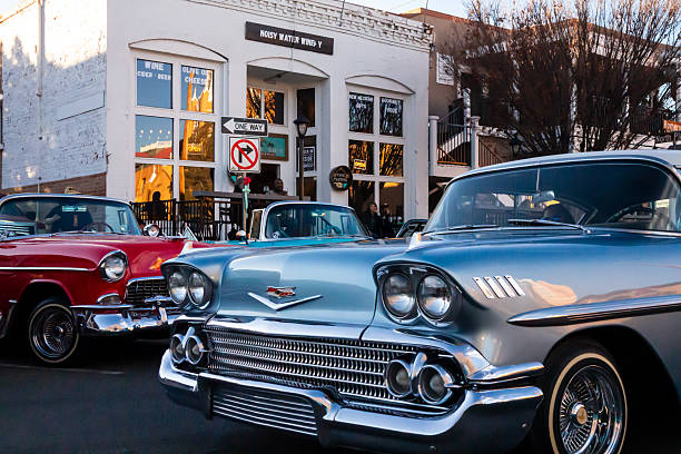 Classic cars cruising in Old Town Albuquerque, New Mexico - February 22, 2026