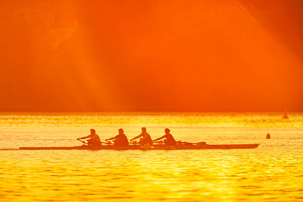 Vancouver Island Saanich Peninsula on Oct 06 2006: Rowing scull practice at sunrise on Elk Lake in the Saanich Peninsula on Vancouver Island, British Columbia