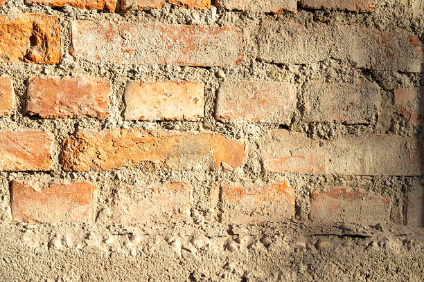 The cleaned brick wall of a 100-year-old house during the reconstruction time.