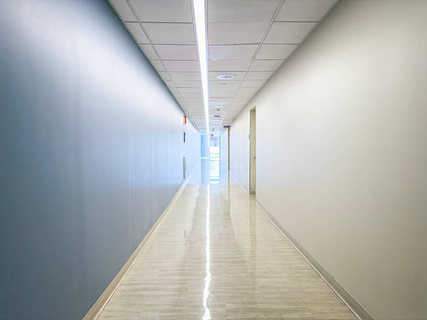 istock Modern Hospital Corridor Blue White Walls Polished Floor Long View 2263547629