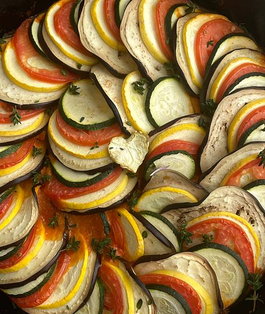 Colorful ratatouille made with sliced vegetables simmered in a rich tomato base. Fresh, vibrant, and aromatic, highlighting rustic French comfort food with natural flavors and visual elegance.