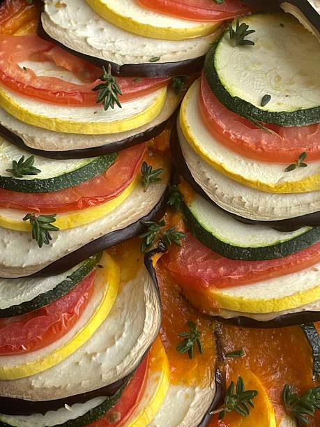 Colorful ratatouille made with sliced vegetables simmered in a rich tomato base. Fresh, vibrant, and aromatic, highlighting rustic French comfort food with natural flavors and visual elegance.
