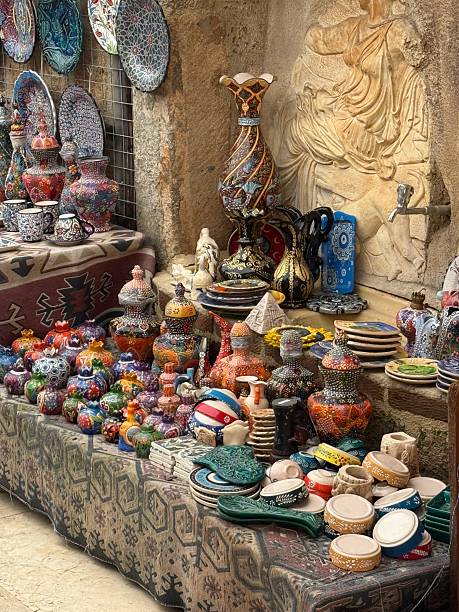 Ceramic crafts on display at traditional market with colorful patterns and textures, artistic background. Mobile photo