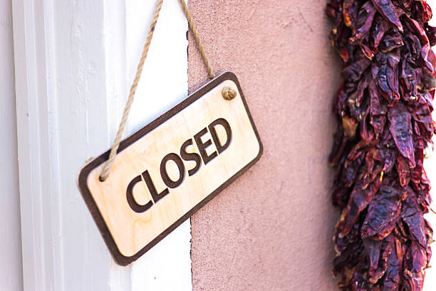 Santa Fe, NM: CLOSED Sign Hanging Next to Pepper Ristra