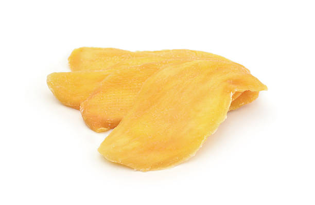 Several dried mangoes isolated on white.