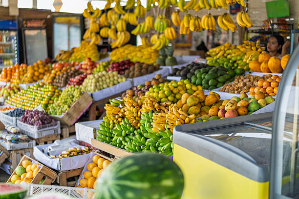 Selling fresh tropical fruit at vibrant street market stall
