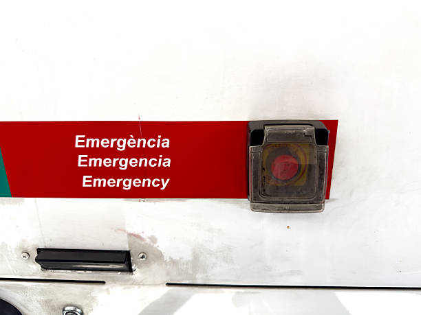 Barcelona - Spain; February 27, 2026: Red emergency push button in public transport. Perfect for illustrating urban safety features, municipal transit services and passenger accessibility.
