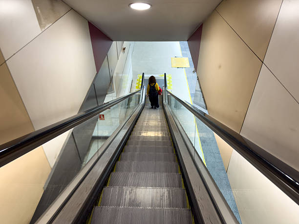 Barcelona - Spain; February 27, 2026: Passengers moving towards the train tracks. Perfect for illustrating public infrastructure, travel logistics, metropolitan mobility and city transit.