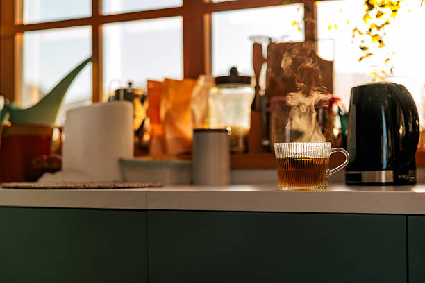Hot Cup Of Tea On Kitchen Counter In Warm Morning Light