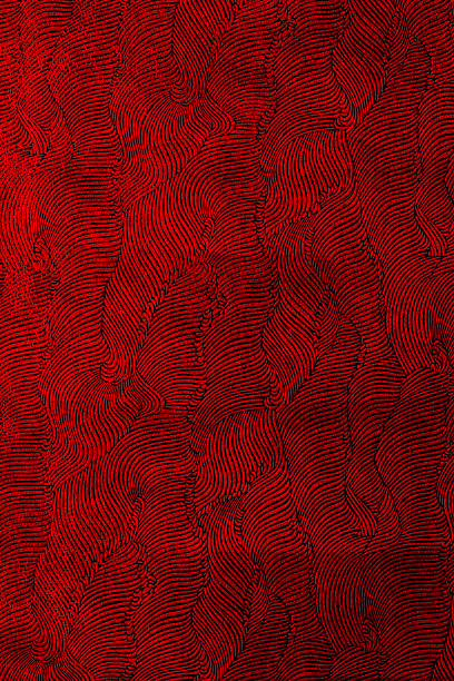Red waves intersect across the artwork creating a flowing design. The deep color and texture invite viewers to explore the patterns. Artists use tools to create depth and lines.
