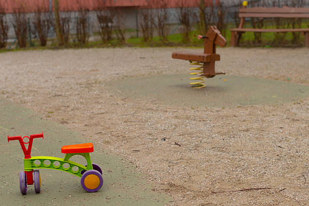 Silent playground scene. Playground toys evoke calm nostalgia. Quiet park setting with toys and peaceful mood. Empty play area with toys and muted colors create nostalgic tranquility