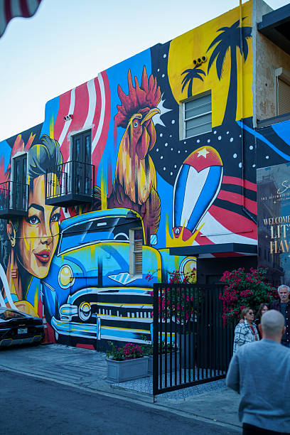 USA, Miami, FL-January 01, 2026: Large street mural on a building wall. Local artists painted this rooster and classic car scene to celebrate the Cuban-American identity and history, attracting tourists who visit the district to document its world-famous graffiti and public art installations.