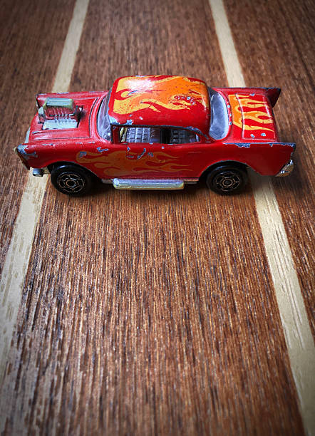 Beat up red hot car on a race track