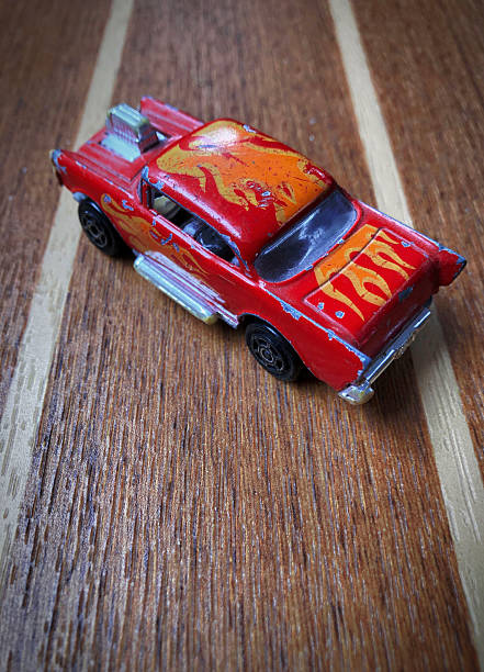 Beat up red hot car on a race track