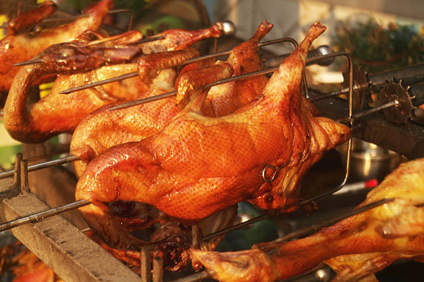Grilling ducks in bbq grill